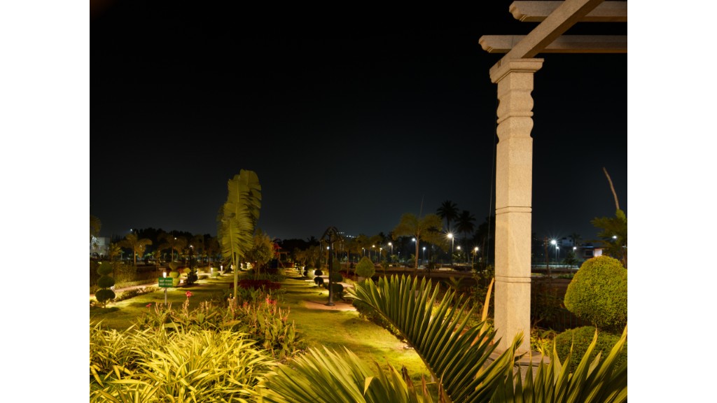 36 Avenue Park at night with carved stone pillar and garden lighting