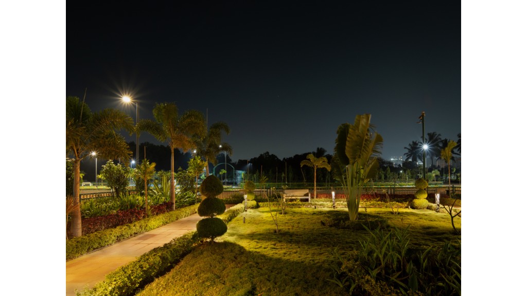 36 Avenue Park lawn, palm trees and bollard lighting