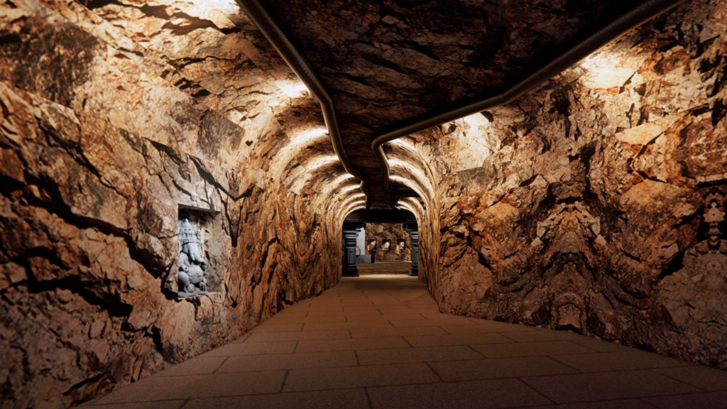 Kailashgiri curving cave corridor with Ganesha niche and lighting