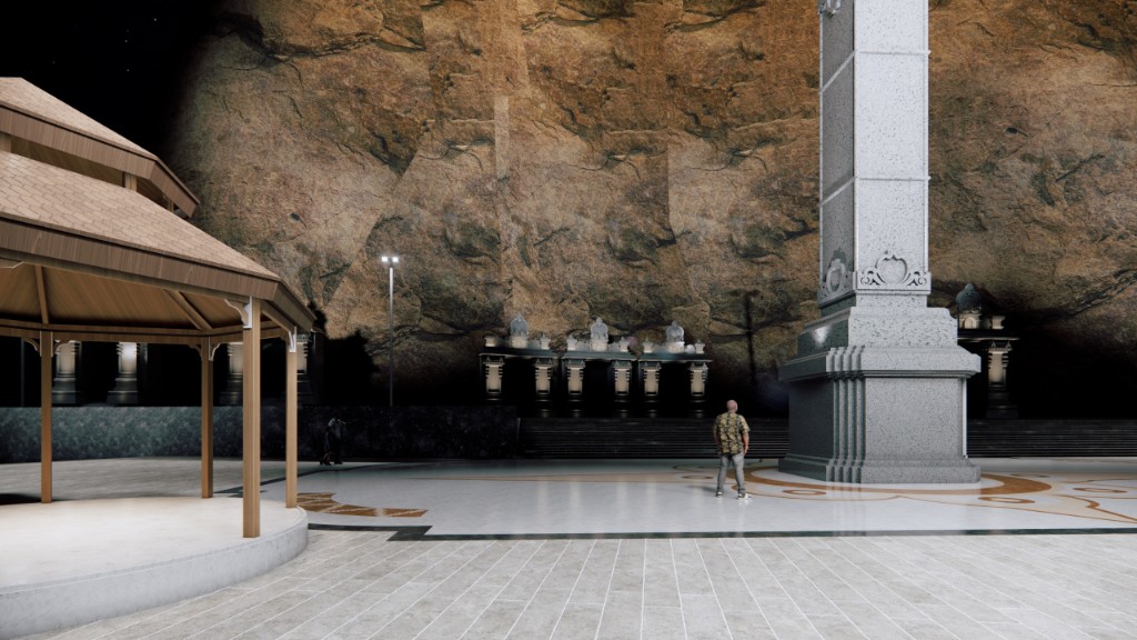 Kailashgiri plaza at night with rock face, stambha and pavilion