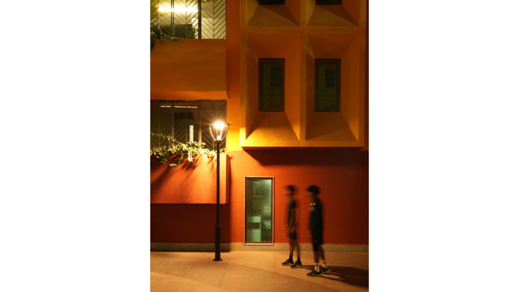 Manipal campus building facade at night with warm exterior lighting